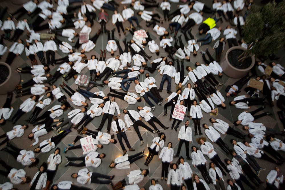 Some 100 Harvard Medical School on Wednesday protested deaths of unarmed black men at the hands of police as well as racial inequality in medical treatment. (Jesse Costa/WBUR)