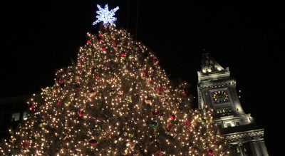 Miriam Stein: &quot;What really makes me feel like I don’t belong are the official ways that Christmas is celebrated in our supposedly secular country. December 25 is a legal holiday. Many public offices feature wreaths and Santa Claus, symbols of the season.&quot; Pictured: Christmas lights glow on the tree at Faneuil Hall in Boston. (Charles Krupa/AP)