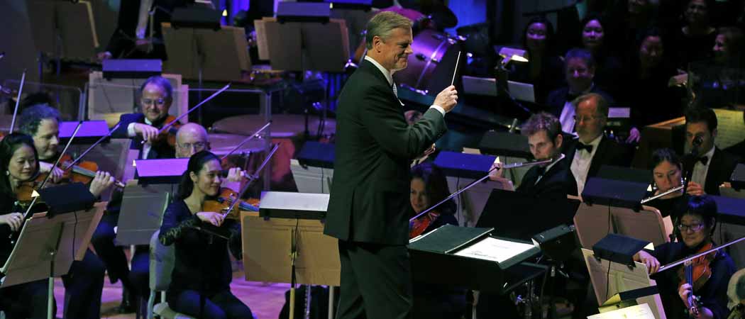  Charlie Baker, waves a baton as the Boston Pops Orchestra performs &quot;Sleigh Ride&quot; during the 31st annual &quot;A Company Christmas at Pops&quot; at Symphony Hall. (Elise Amendola/AP)