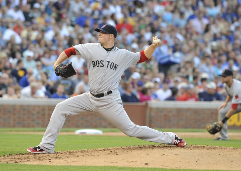 Former Boston and Oakland ace Jon Lester will return to Wrigley Field in 2015 -- this time as a member of the Chicago Cubs. (David Banks/Getty Images)