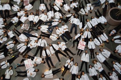 A story about Harvard Medical School students protesting grand jury decisions in NYC and Missouri — with this photo — was among our top tweets this year. (Jesse Costa/WBUR)