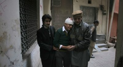 The uncle and cousin of injured student Mohammad Baqair, center, comfort him as he mourns the death of his mother, who was a teacher at the school that was attacked by Taliban, in Peshawar, Pakistan, Tuesday, Dec. 16, 2014. Taliban gunmen stormed a military-run school in the northwestern Pakistani city of Peshawar on Tuesday, killing more than 100, officials said, in the highest-profile militant attack to hit the troubled region in months. (Mohammad Sajjad/AP)