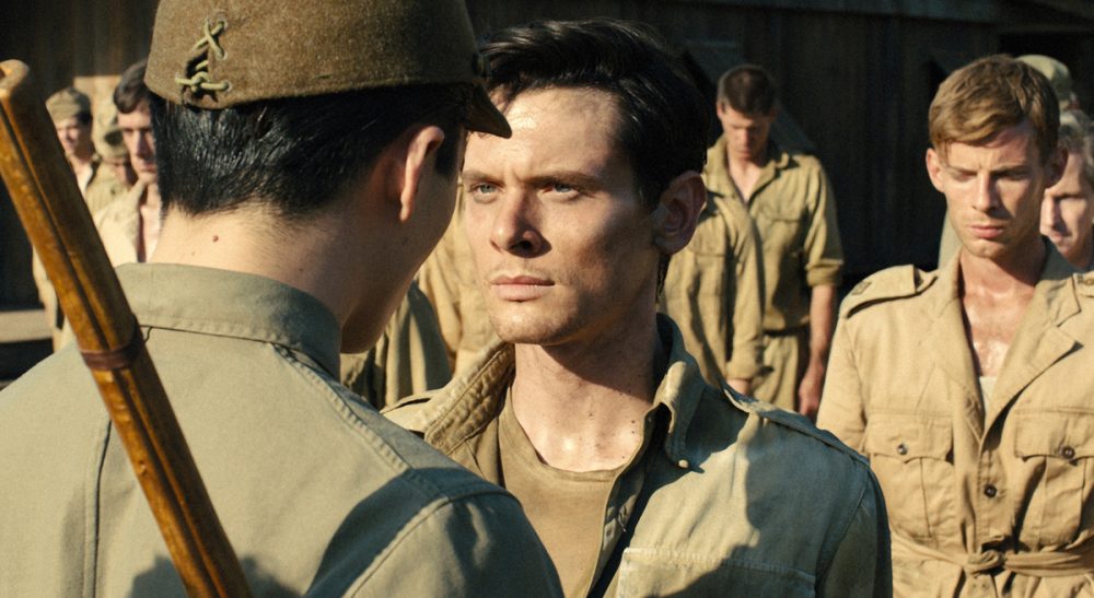 Sari Edelstein: It is difficult to swallow an easy binary between American freedom and totalitarian abuses when the film’s release occurred just weeks after the disclosure of the Senate report on CIA torture. Pictured: Jack O'Connell portrays Olympian and war hero Louis &quot;Louie&quot; Zamperini in a scene from &quot;Unbroken.&quot; (Universal Pictures/AP)