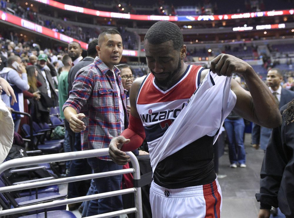 Washington Wizards guard John Wall (2) reacts after an NBA basketball game against the Boston Celtics, Monday, Dec. 8, 2014, in Washington. The Wizards won 133-132 in double overtime. (Nick Wass/AP)