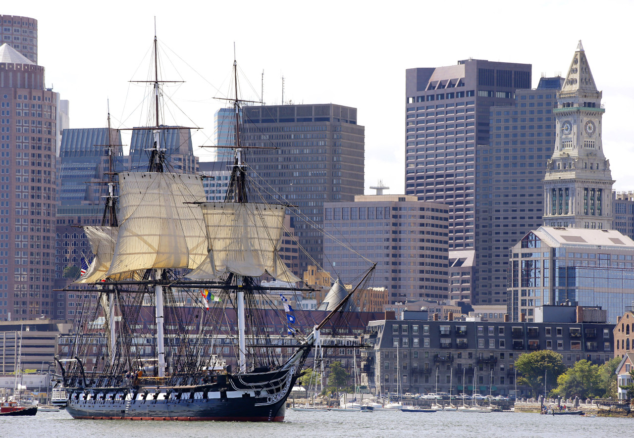 The U.S.S. Constitution, or &quot;Old Ironsides,&quot; the U.S. Navy's oldest commissioned ship that is still afloat, is towed through Boston Harbor past the financial district skyline with its topsails unfurled in August 2014 in Boston. (AP)