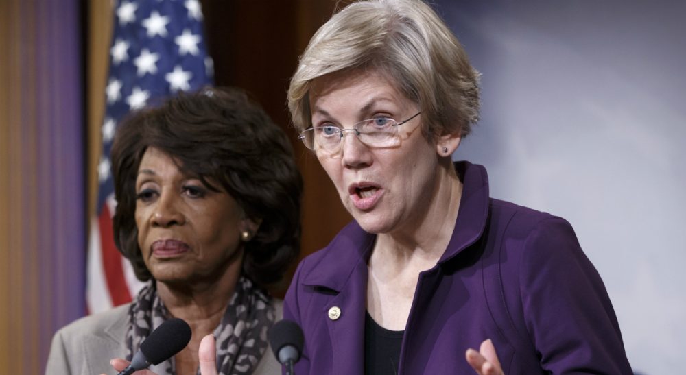 Elizabeth Warren, D-Mass., a member of the Senate Banking Committee, and Rep. Maxine Waters, D-Calif., left, ranking member of the House Financial Services Committee, express their outrage to reporters that a huge, $1.1 trillion spending bill, passed by the Republican-controlled House yesterday, contains changes to the 2010 Dodd-Frank law that regulates complex financial instruments known as derivatives. (J. Scott Applewhite/AP)