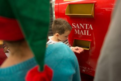 Dominic Tortolano, 4, of Smithfield, R.I., checks inside Santa's mailbox at the Macy's Believe launch event at Macy's department store on Friday, Nov. 8, 2013 in Warwick, Rhode Island.  (AP)