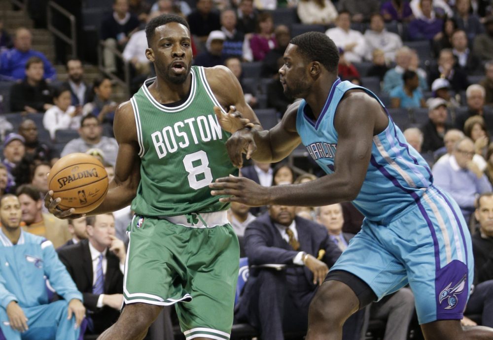 Boston Celtics' Jeff Green (8) drives against Charlotte Hornets' Lance Stephenson (1) during the first half of an NBA basketball game in Charlotte, N.C., Wednesday, Dec. 10, 2014. (Chuck Burton/AP)