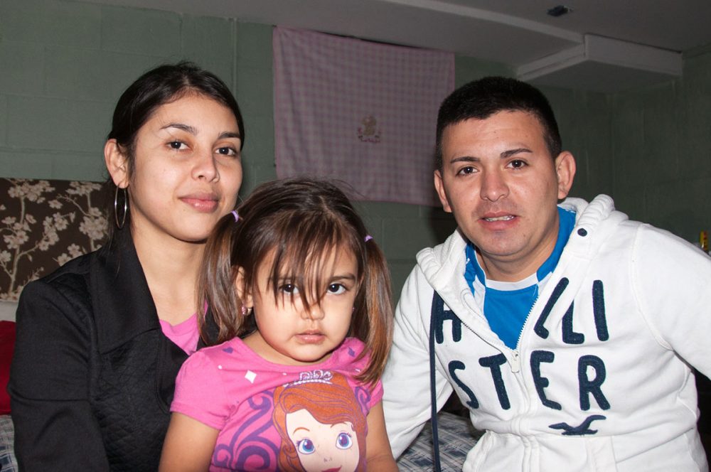 Along with many others from Aqua Caliente, El Salvador, Quenia, left, Salvador and their 6-year-old daughter are now living on Nantucket. (Shannon Dooling/WBUR)