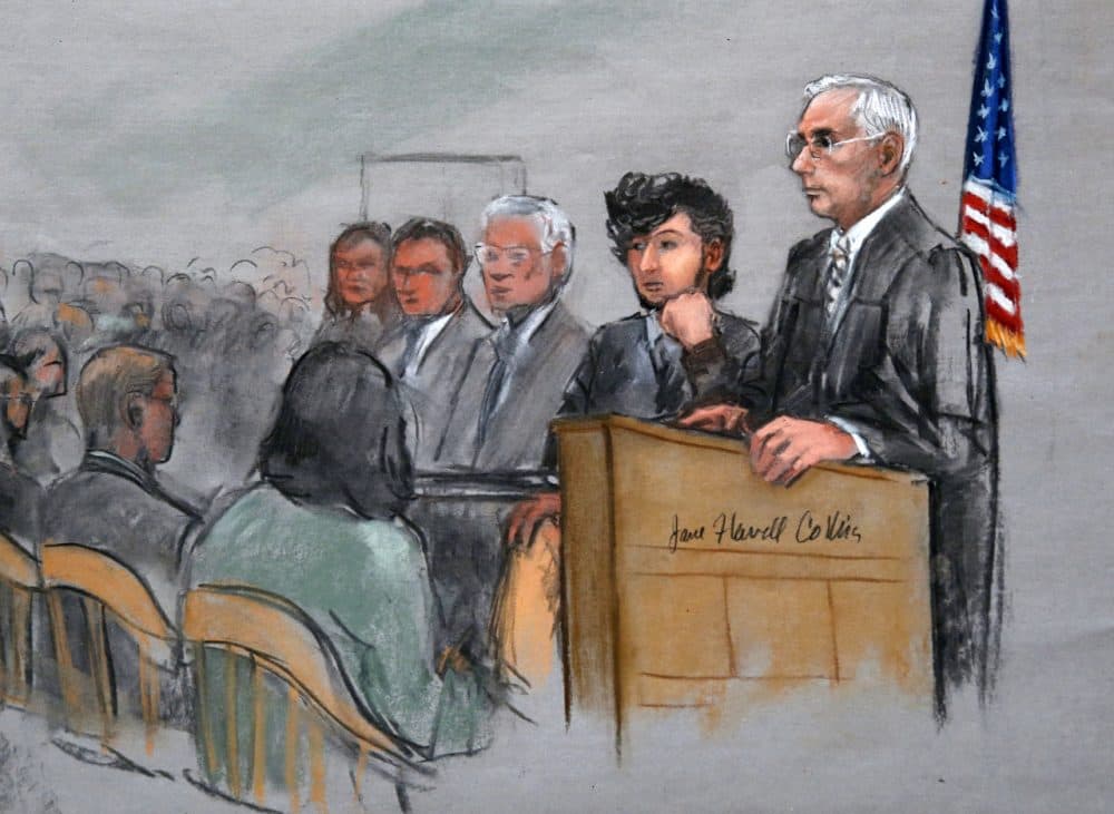 In this courtroom sketch, Boston Marathon bombing suspect Dzhokhar Tsarnaev, second from right, is depicted with his lawyers, left, beside U.S. District Judge George O'Toole Jr., right, as O'Toole addresses a pool of potential jurors earlier this month. (Jane Flavell Collins/AP)