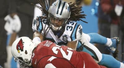 Garry Emmons: “The joy of manly contest” has become ever more bittersweet. In this photo, Arizona Cardinals running back Marion Grice hits the ground as Carolina Panthers free safety Tre Boston defends in the second half of an NFL wild card playoff football game in Charlotte, N.C., Saturday, Jan. 3, 2015. (Bob Leverone/AP)