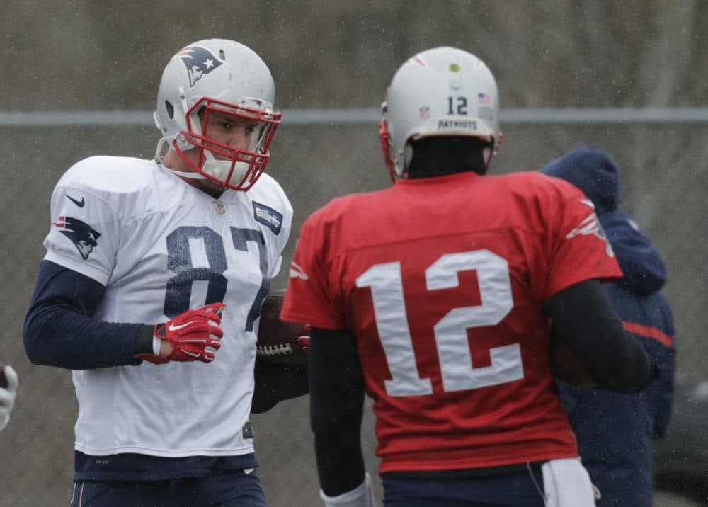 When the New England Patriots face the Baltimore Ravens in the AFC playoffs on Saturday, quarterback Tom Brady (r) will have Rob Gronkowski available.  The tight end missed the last playoff game betwen the the teams. (Charles Krupa/AP)