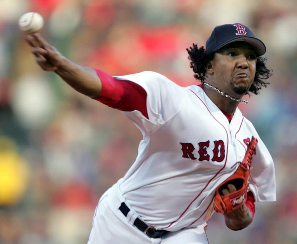 In this Oct. 18, 2004, file photo, Boston Red Sox starter Pedro Martinez throws to the New York Yankees in the first inning of Game 5 of the ALCS in Boston. Martinez was elected to the National Baseball Hall of Fame Tuesday. (Charles Krupa/AP)