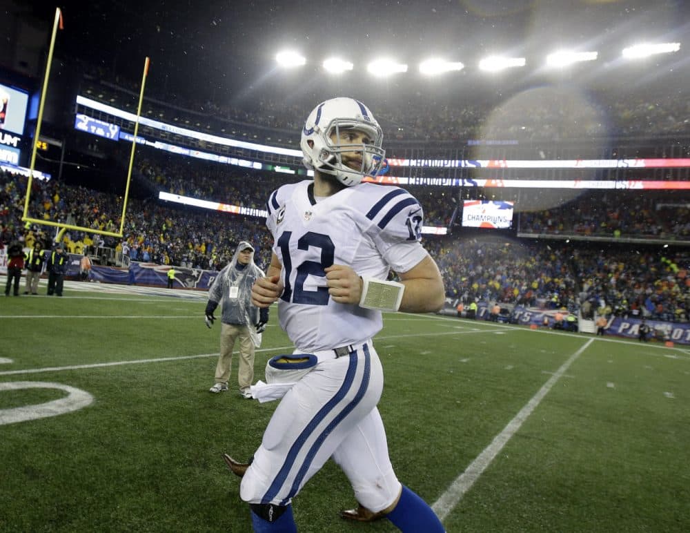 Indianapolis Colts quarterback Andrew Luck runs off the field after the NFL football AFC Championship game against the New England Patriots Sunday. (Matt Slocum/AP)