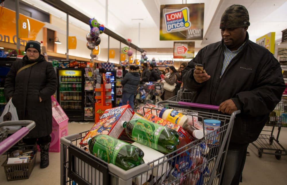 In this 2016 file photo, a customer stocks up on goods at the Stop & Shop at South Bay in Boston. (Robin Lubbock/WBUR)
