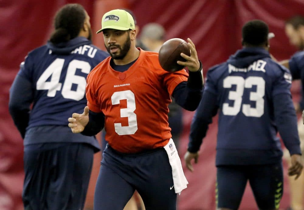 Seattle Seahawks quarterback Russell Wilson runs drills with his team on Friday before Sunday's Super Bowl. (Matt York/AP)
