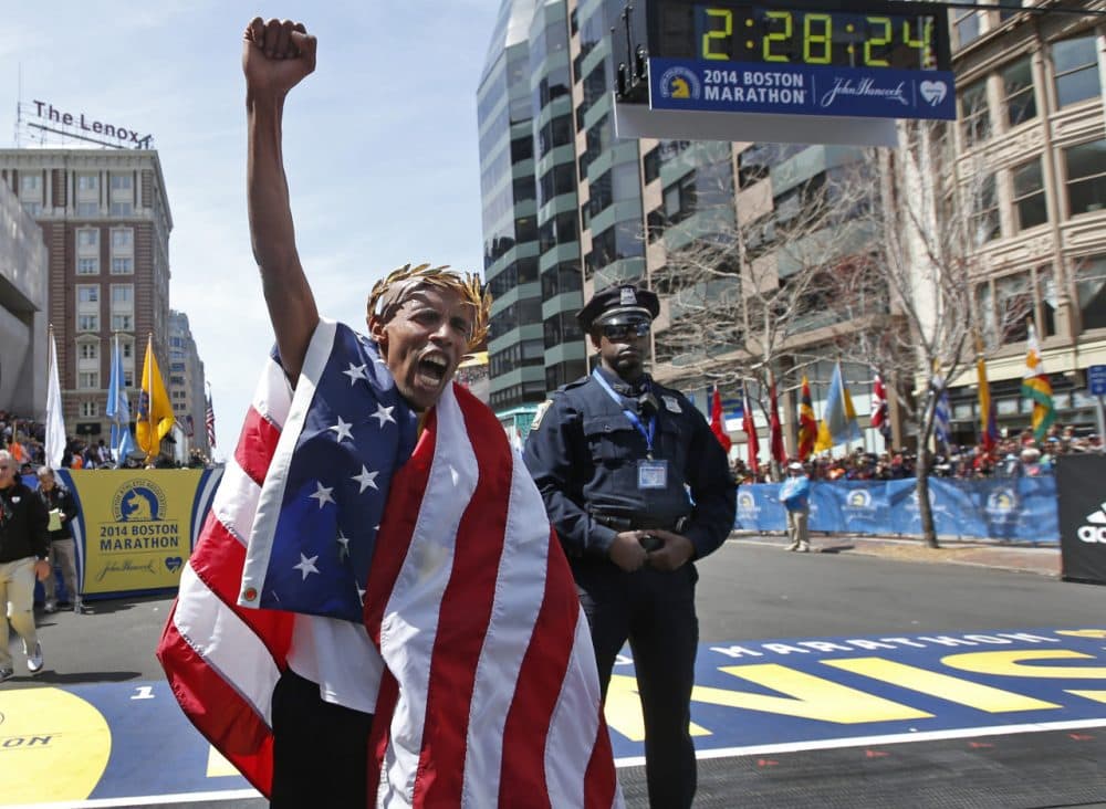 Meb Keflezighi celebrates his 2014 Boston Marathon victory. (Elise Amendola/AP)
