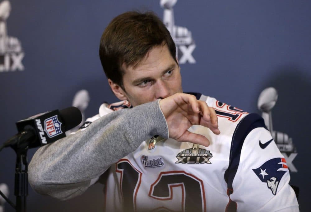 Patriots quarterback Tom Brady listens to a question during a news conference Wednesday in Arizona. (Mark Humphrey/AP)