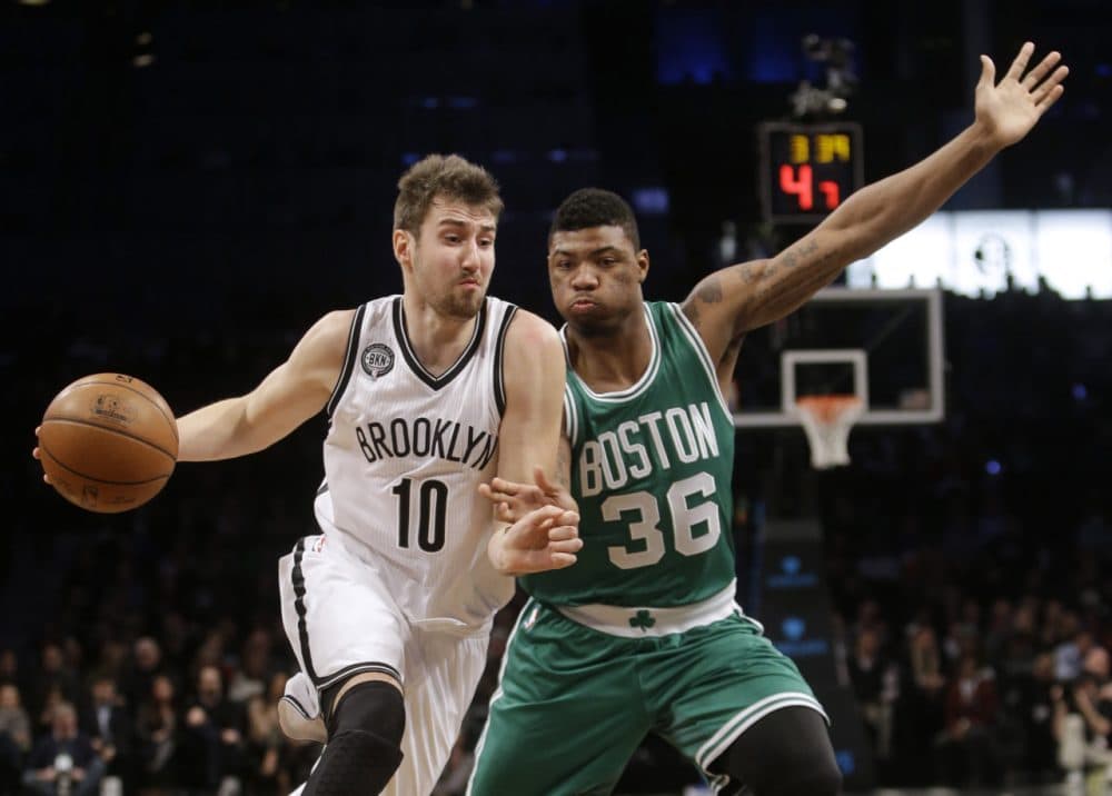 Brooklyn Nets' Sergey Karasev (10), of Russia, drives past Boston Celtics' Marcus Smart (36) during Wednesday's game on, Jan. 7, 2015, in New York. (Frank Franklin II/AP)