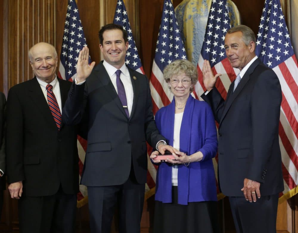 Speaker John Boehner administers the House oath to Rep. Seth Moulton, second from left, during a ceremonial re-enactment swearing-in Tuesday on Capitol Hill. (Pablo Martinez Monsivais/AP)