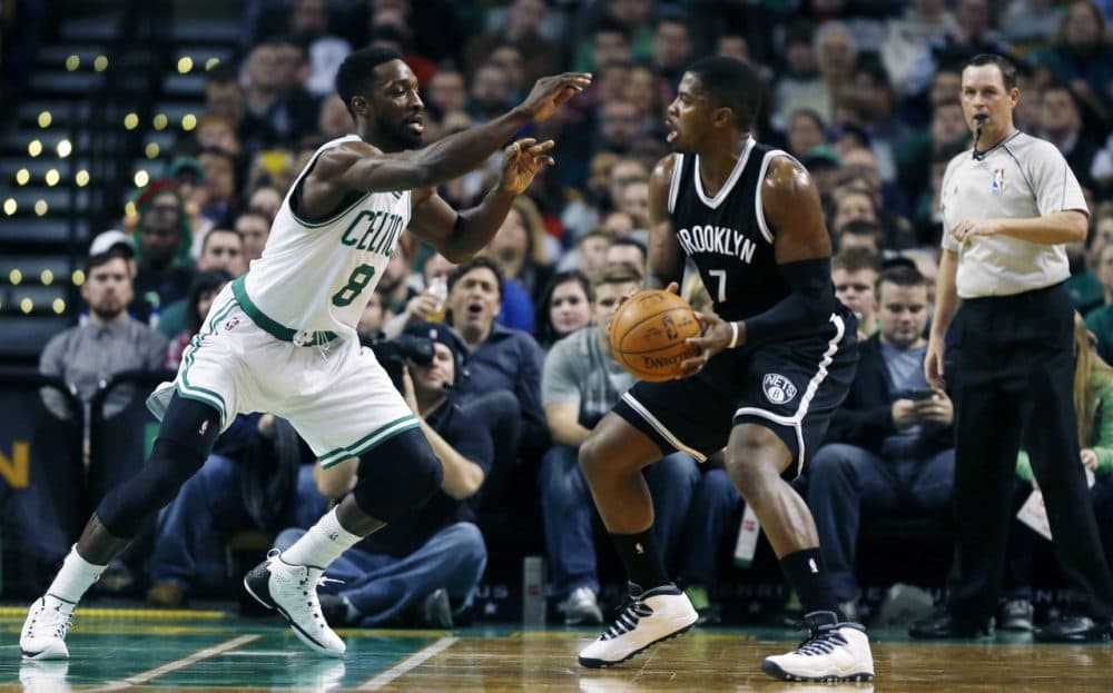 Boston Celtics' Jeff Green (8) defends against Brooklyn Nets' Joe Johnson (7)  in Boston on Friday, Dec. 26, 2014. (Michael Dwyer/AP)