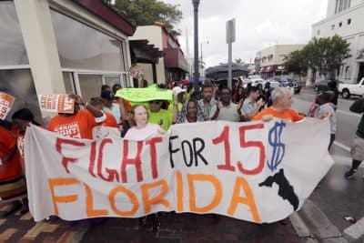 People march as they protest for increased minimum wages near a McDonald's restaurant on Thursday, Dec. 4, 2014, in the Little Havana area in Miami.  (AP)