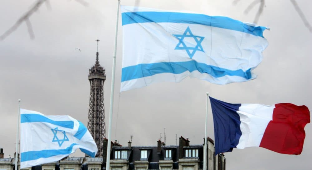 Israeli and French flags fly at the Place des Invalides in Paris, Tuesday, March 11, 2008, on the second day of then-Israeli President Shimon Peres's four-day state visit in France. (Remy de la Mauviniere/AP)
