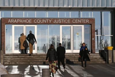 People enter the Arapahoe County Justice Center in Centennial, Colo., Tuesday, Jan. 20, 2015. The jury selection process in the trial of Aurora theater shooting suspect James Holmes began Tuesday, and is expected to take several weeks to a few months. Holmes is charged with killing 12 people and wounding more than 50 in an Aurora movie theater in 2012 (AP)