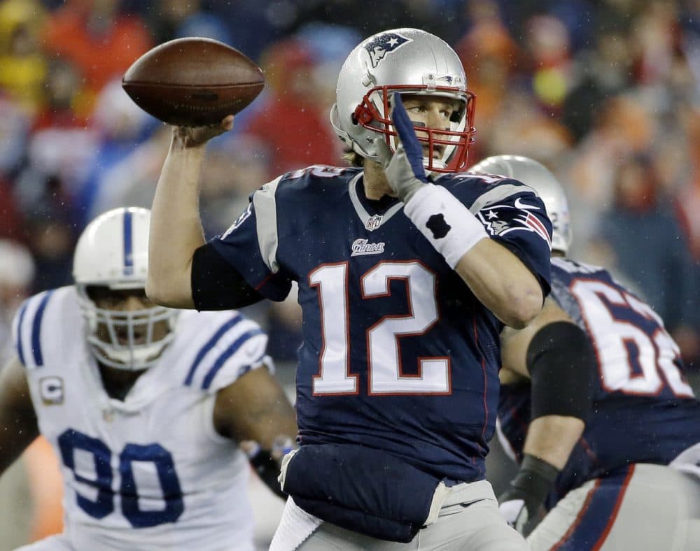 New England Patriots quarterback Tom Brady looks to pass during the AFC Championship game against the Indianapolis Colts in Foxborough on Sunday. The NFL is investigating whether the Patriots deflated footballs that were used in the victory. (Matt Slocum/AP)