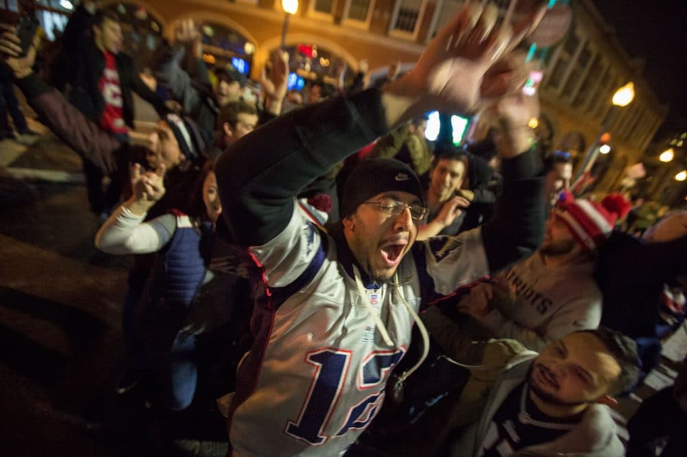Fans celebrate the Patriots win on Brookline Ave. (Jesse Costa/WBUR)