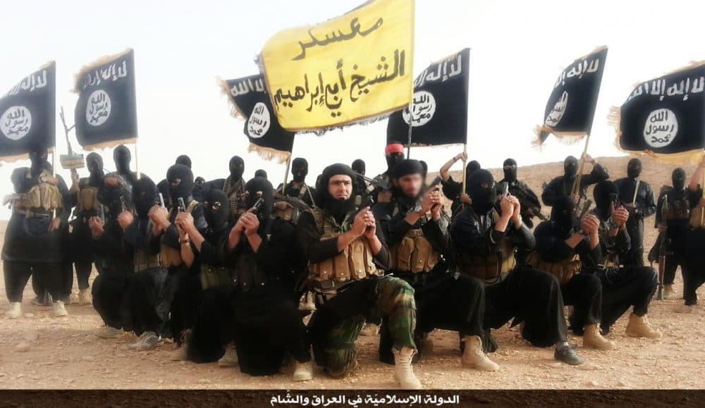 A promotional image of members of the group that calls itself the Islamic State (ISIS), taken in Anbar province in 2014.(Wikimedia Commons)