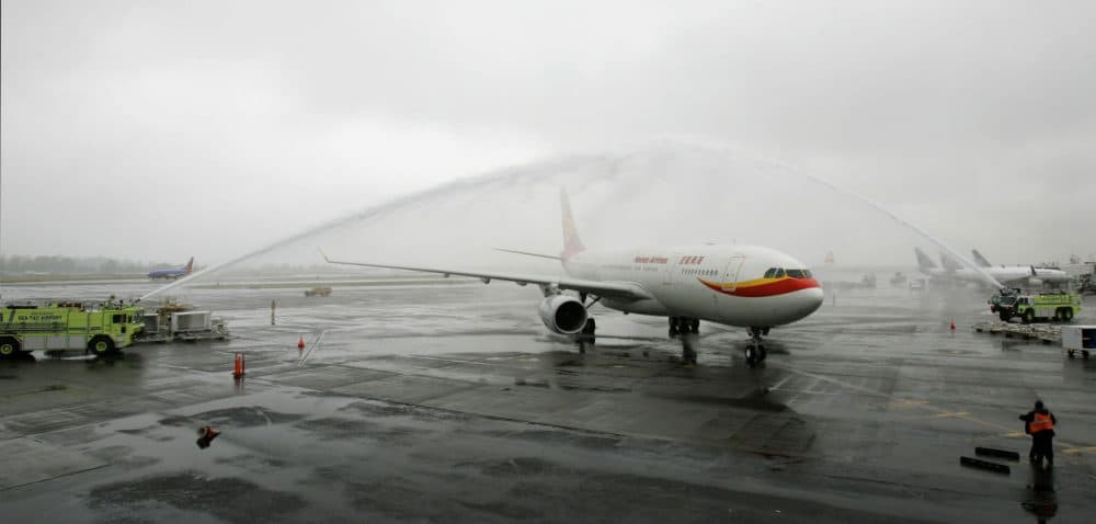 In this 2008 file photo, a Hainan Airlines Airbus A330-200 airplane is given a water salute as it arrives at Seattle-Tacoma International Airport. Hainan will begin Boston to Shanghai nonstop flights in June. (Ted S. Warren/AP)