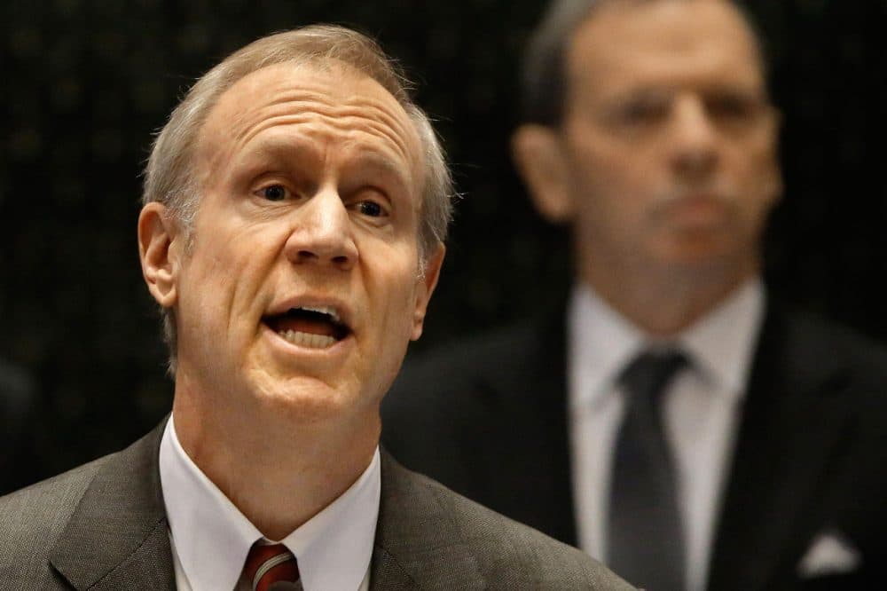 Illinois Gov. Bruce Rauner delivers his State of the Budget address to a joint session of the General Assembly in the House chambers, Wednesday, Feb. 18, 2015, in Springfield Ill. (Seth Perlman/AP)