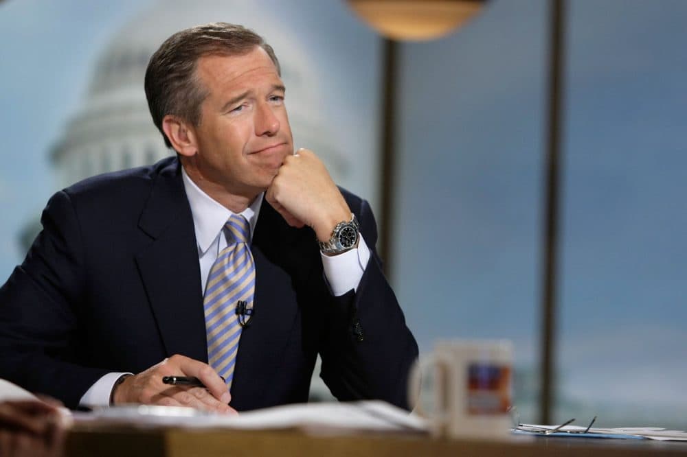 Moderator Brian Williams watches a video which pays tribute to late moderator Tim Russert during a taping of &quot;Meet the Press&quot; at the NBC studios June 22, 2008 in Washington, DC. (Alex Wong/Getty Images for Meet the Press)