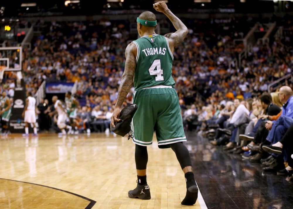 Phoenix Suns Boston Celtics' Isaiah Thomas (4) pumps his fist after losing his shoe during the second half Monday night's game against the Phoenix Suns on Feb. 23, 2015, in Phoenix. The Celtics won 115-110. (Matt York/AP)