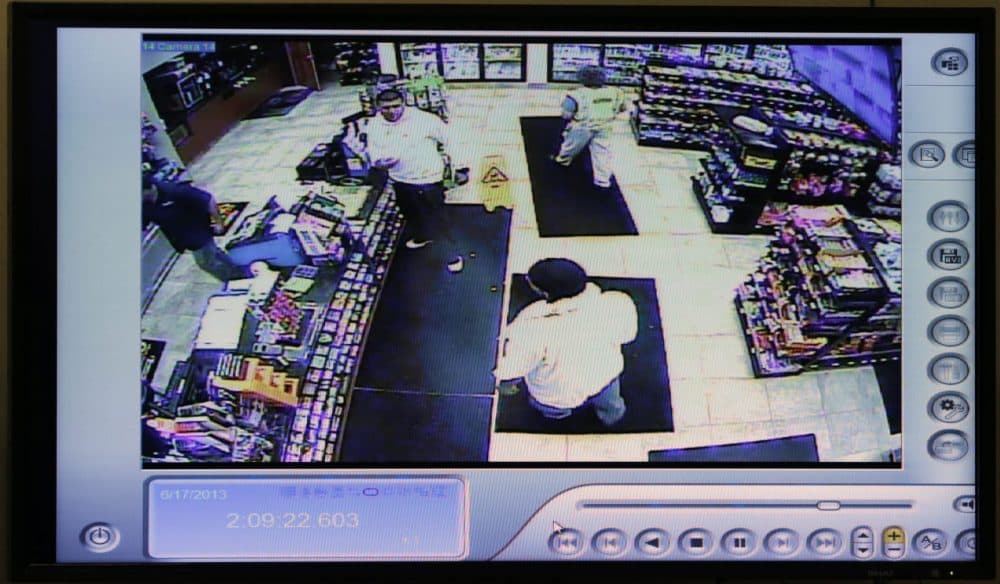 A still image from a courtroom video display shows Aaron Hernandez visiting a gas station about an hour before prosecutors say Odin Lloyd was killed. (Charles Krupa/AP/Pool)