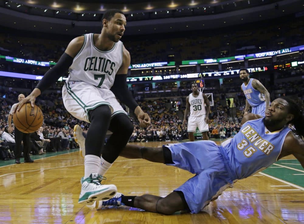 Denver Nuggets forward Kenneth Faried (35) falls to the floor after fouling Boston Celtics forward Jared Sullinger (7) in Wednesday night's game in Boston, Feb. 4, 2015. The Celtics won 104-100. (Elise Amendola/AP)