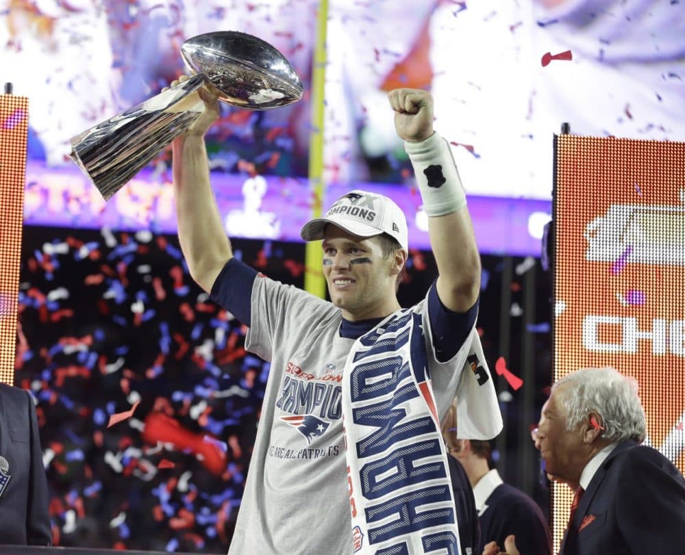 New England Patriots quarterback Tom Brady celebrates with the Vince Lombardi Trophy after the NFL Super Bowl XLIX football game against the Seattle Seahawks Sunday. (Michael Conroy/AP)