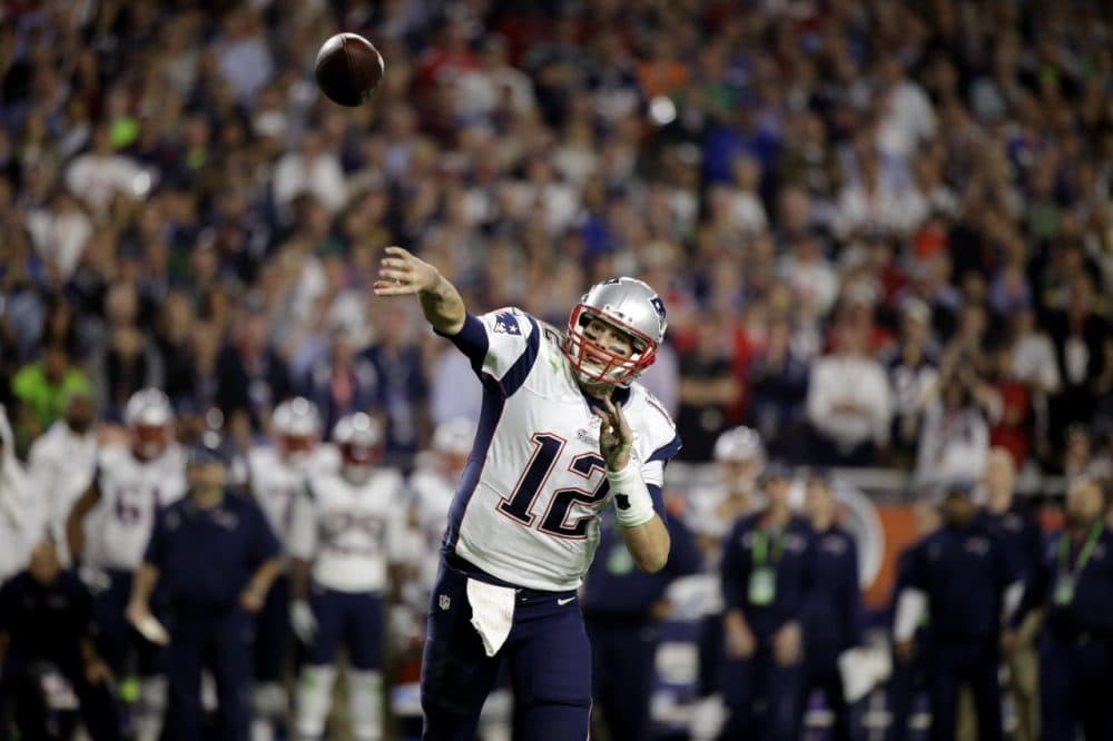 Tom Brady thew two fourth-quarter touchdown passes to put the Patriots ahead 28-14 . (David Goldman/AP)