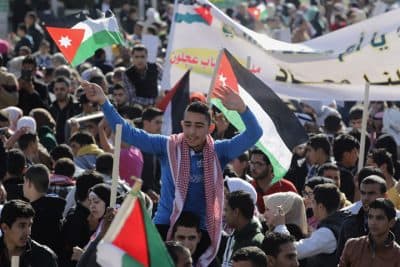 Jordanians chant slogans to show their support for the government against terror during a rally in Amman, Jordan, Thursday, Feb. 5, 2015. Jordanian warplanes bombed Islamic State targets on Thursday, state TV said, after Jordan's King Abdullah II vowed to wage a &quot;harsh&quot; war against the militants who control large areas of neighboring Syria and Iraq. (AP)