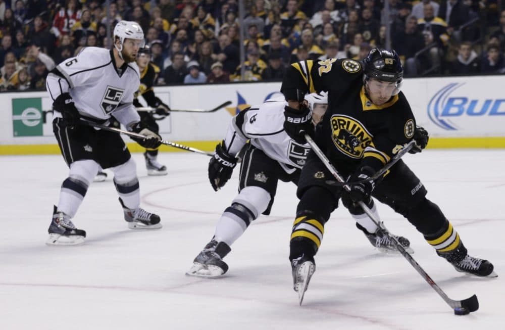 Boston Bruins left wing Brad Marchand (63) skates against the Los Angeles Kings during the second period of an NHL hockey game in Boston Saturday. (Charles Krupa/AP)