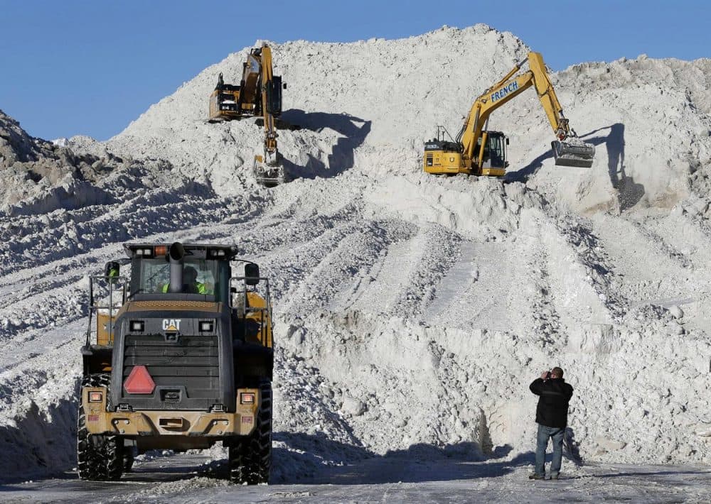 Heavy equipment worked on a mound of snow that had been cleared from city streets at a &quot;snow farm&quot; in Boston, Monday, Feb. 16. (Michael Dwyer/AP)