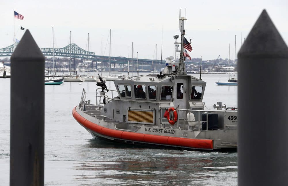 A U.S. Coast Guard vessel patrols Boston Harbor. (Michael Dwyer/AP file photo)