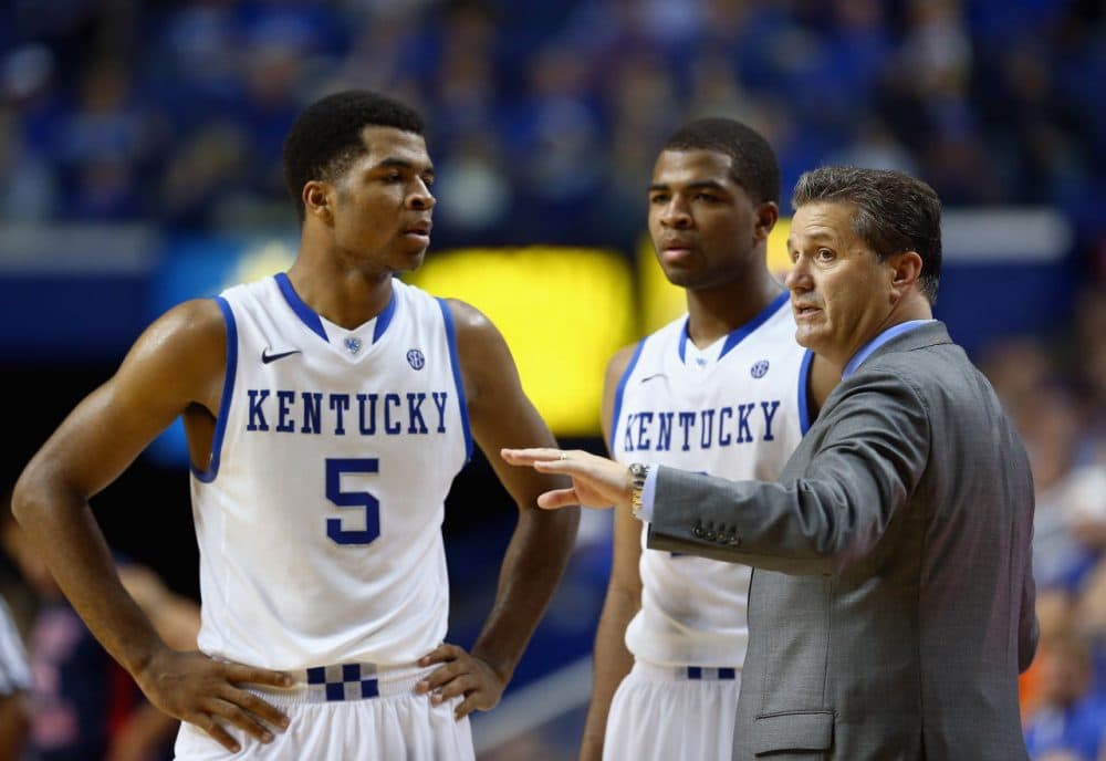 John Calipari's Kentucky Wildcats are off to a 30-0 start, thanks in part to the unexpected returns of sophomores Andrew (left) and Aaron (middle) Harrison. (Andy Lyons/Getty Images)