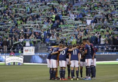 The New England Revolution opened their season in Seattle in front of 40,000 fans. (Ted S. Warren/AP)