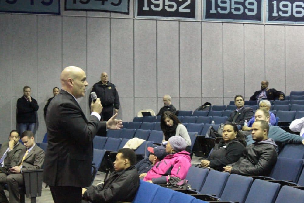 Boston Police Deputy Superintendent John M. Brown addresses parents at English High School, where they spoke about the shooting of a student and the arrest of a dean. Some were frustrated with the low turnout of other parents. (Simón Ríos/WBUR)