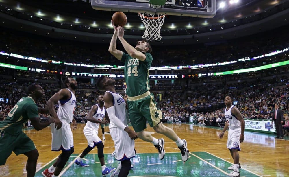 Celtics center Tyler Zeller (44) drives to the basket against the Philadelphia 76ers during the second half.  (AP Photo/Charles Krupa)