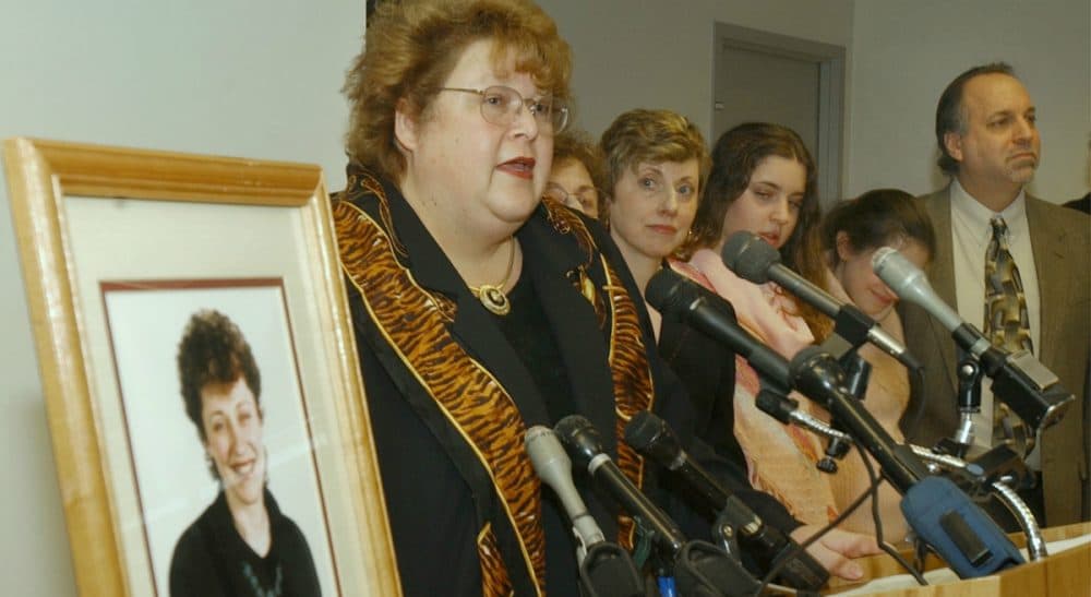 Massachusetts Department of Public Health Commissioner Christy Ferguson stands by late Boston Globe reporter Betsy Lehman’s photo while she announces the creation of the Betsy Lehman Center for Patient Safety and Medical Error Prevention in 2004. (Chitose Suzuki/AP)