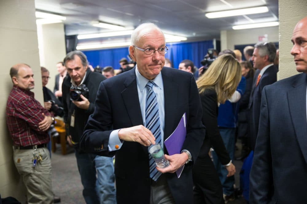 Syracuse coach Jim Boeheim exits following his press conference Thursday morning. Boeheim called the penalties imposed by the NCAA on him and Syracuse &quot;unduly harsh.&quot; (Brett Carlsen/Getty Images)