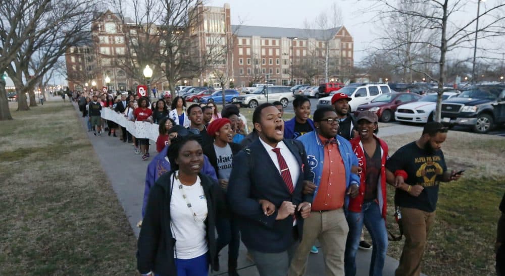University of Oklahoma students march to the now closed University of Oklahoma's Sigma Alpha Epsilon fraternity house during a rally in Norman, Okla., Tuesday, March 10, 2015. The university's president expelled two students Tuesday after he said they were identified as leaders of a racist chant captured on video during a fraternity event. (Sue Ogrocki/AP)